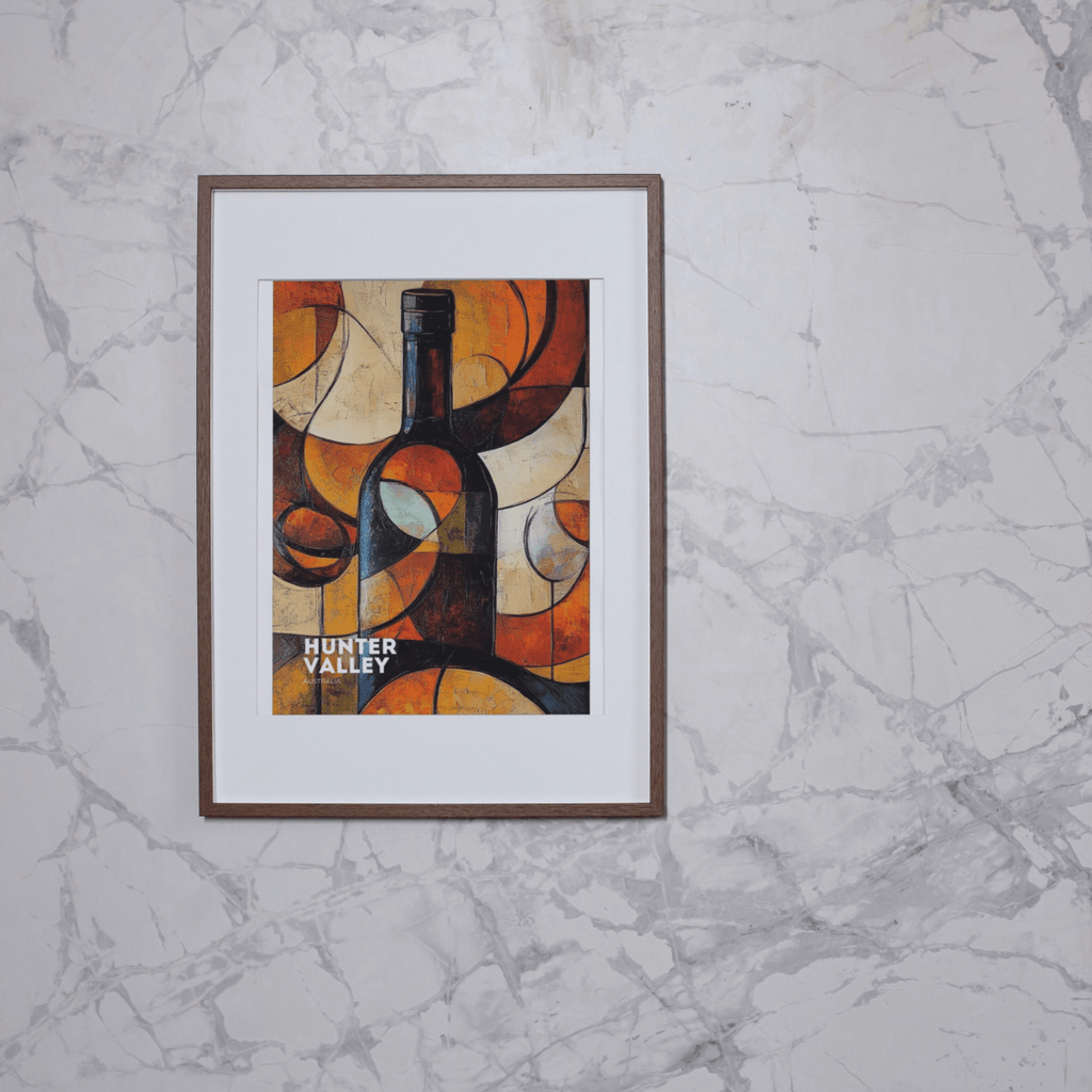 Framed abstract wine bottle poster featuring bold geometric shapes and vibrant colors, displayed on a marble wall. 