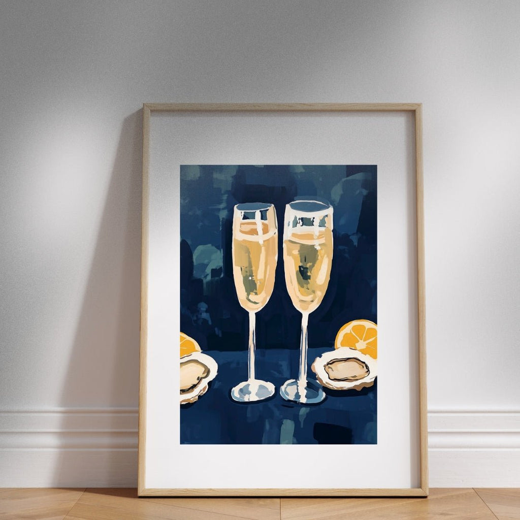 Framed artwork of two champagne glasses with lemons and oysters on a blue background.