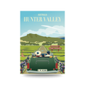Illustration of a car with 'I ❤️ WINE' license plate, scenic vineyard road, and 'Welcome to Wine Country' sign