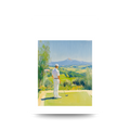 Golf player on a golf course with mountains in the background