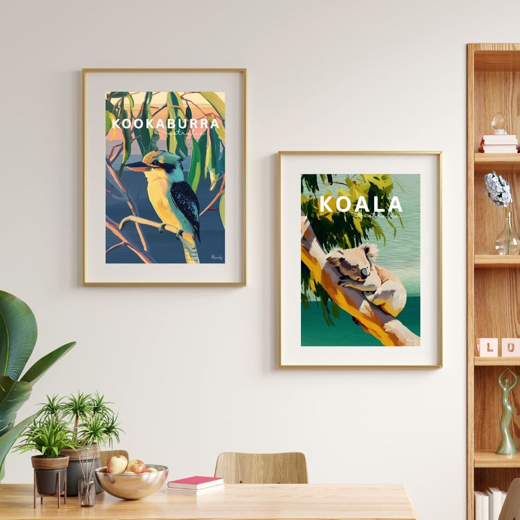 Dining room with framed artwork of a kookaburra and a koala, wooden table, and chairs.