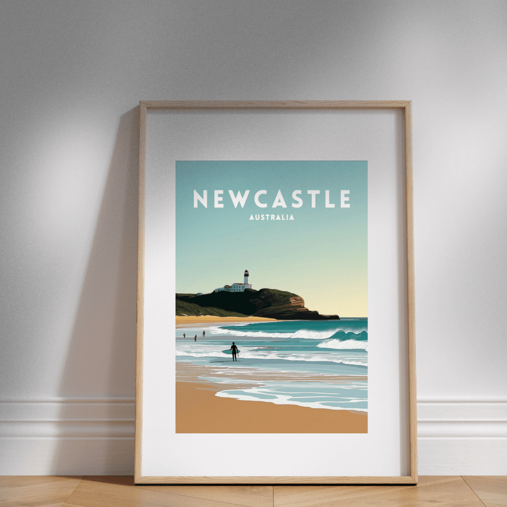 Framed artwork of Newcastle, Australia with a lighthouse on a beach.